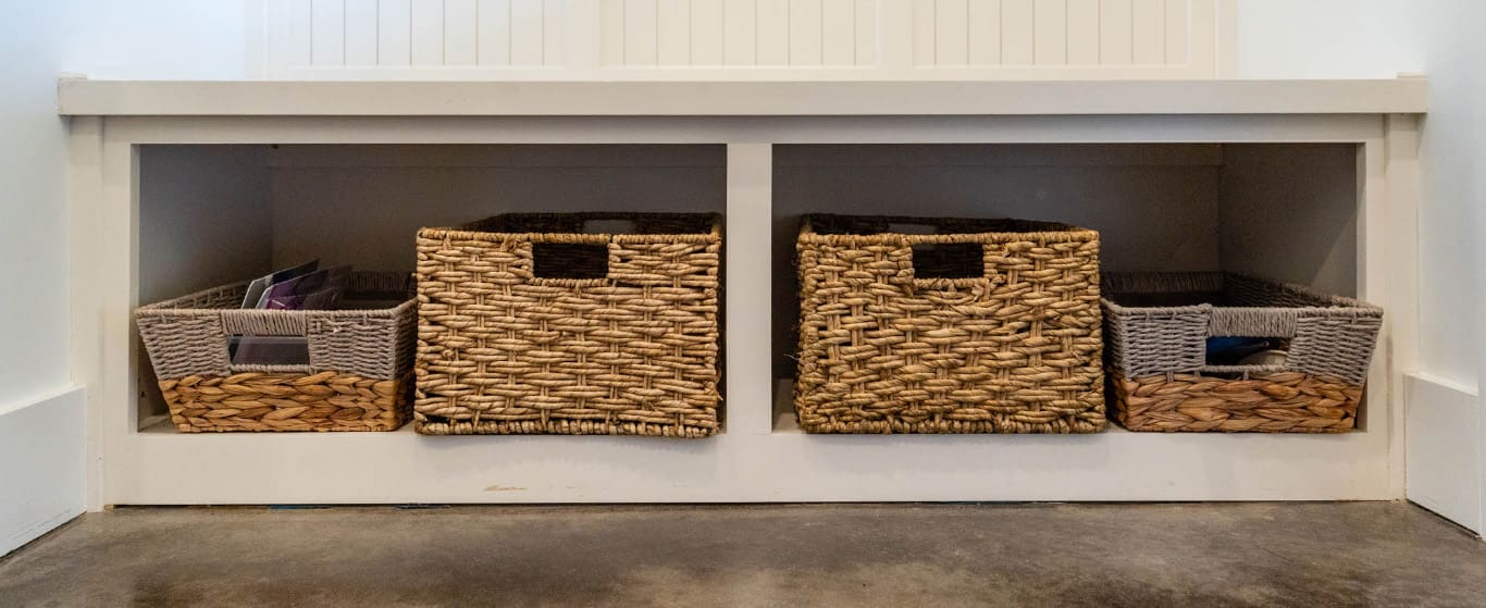 White cabinets with storage and sitting space for a mud room, designed and built by Fred’s Cabinet Shop. Fred's has spent over 50 years perfecting a process that makes creating your custom cabinets simple, stress-free, and enjoyable.