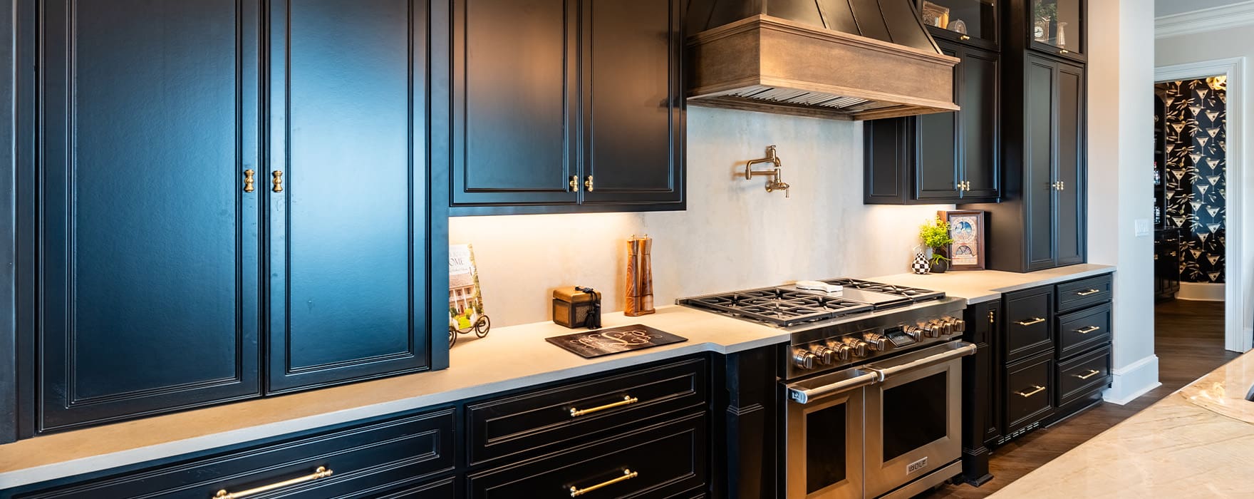 A beautiful kitchen with dark cabinets designed and built by Fred’s Cabinet Shop. Fred's has spent over 50 years perfecting a process that makes creating your custom cabinets simple, stress-free, and enjoyable.