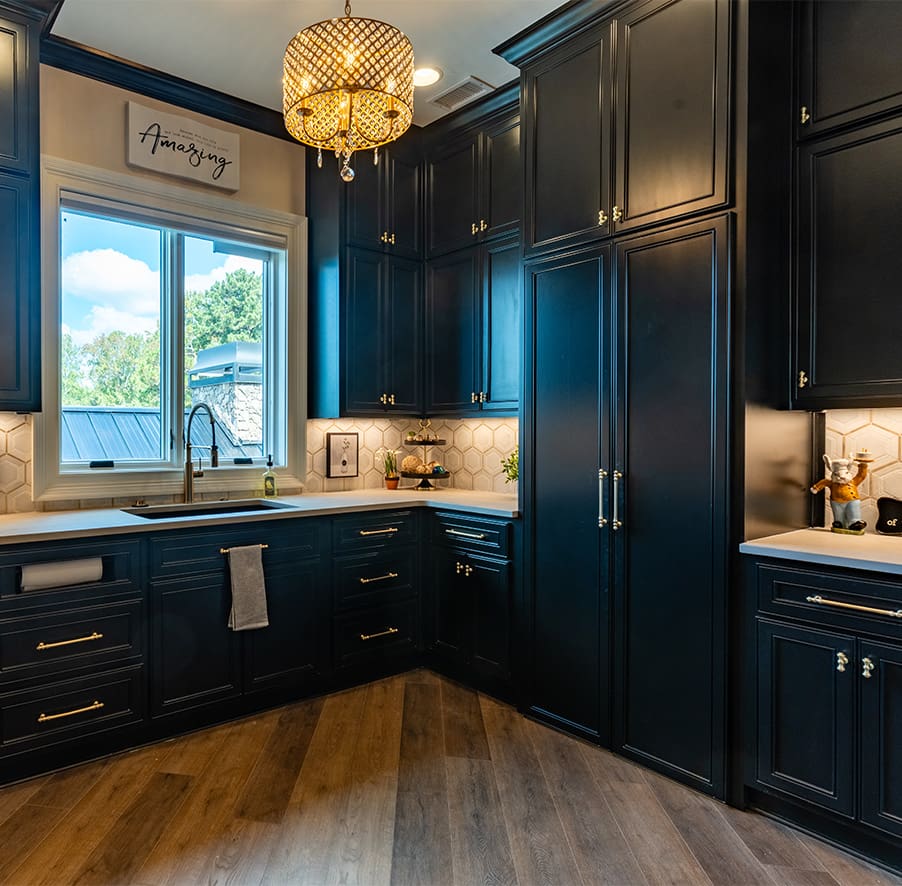 A beautiful kitchen with dark cabinets designed and built by Fred’s Cabinet Shop. Fred's has spent over 50 years perfecting a process that makes creating your custom cabinets simple, stress-free, and enjoyable.